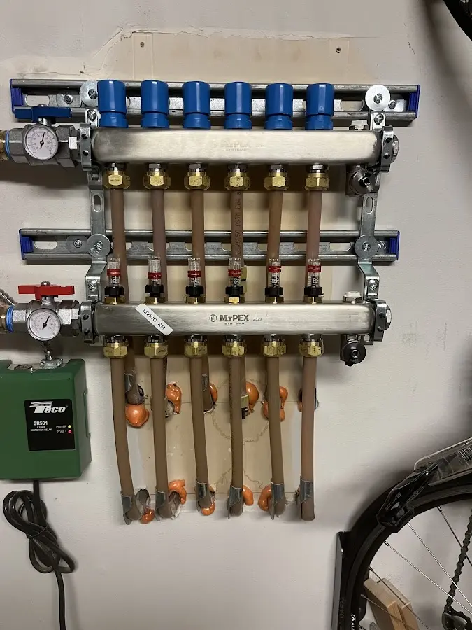 Plumber performing Water Heater Repair at a residential property in Essex